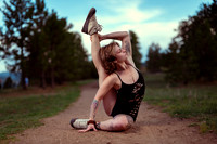 Riley in a compass pose during an outdoor yoga photoshoot in the mountains.
