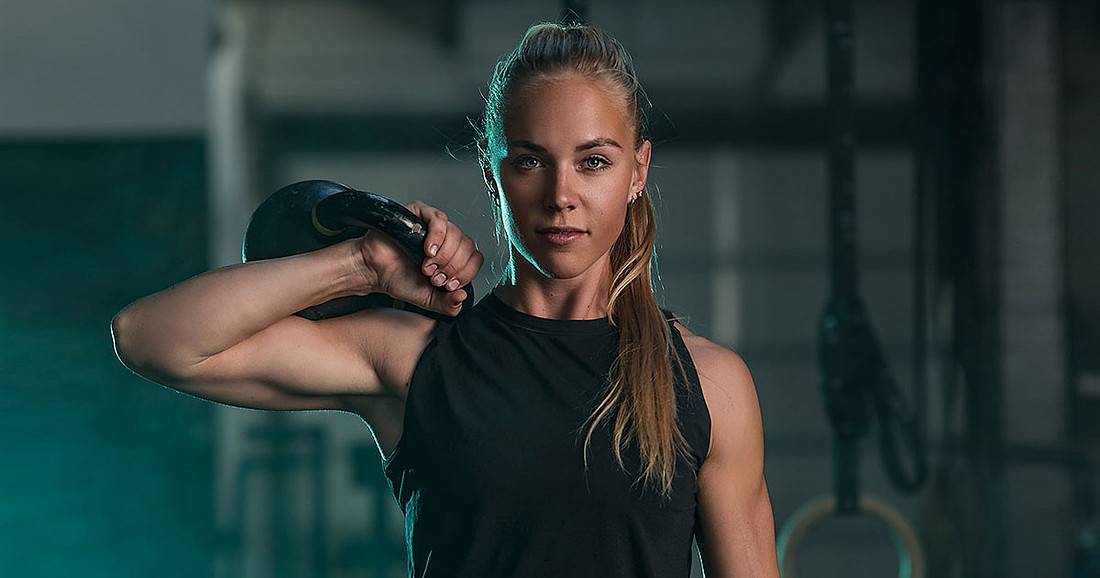 Fitness photoshoot in gym of CrossFit girl.