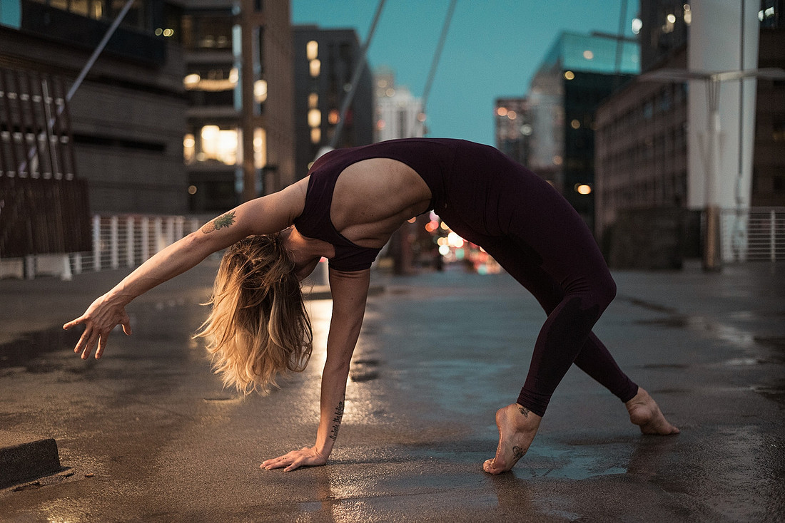 Best yoga photos #11 - Yoga girl Kendra Miller doing a wild thing pose in the rain storm.